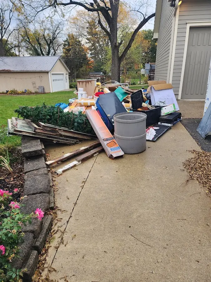 Dumpster being loaded with debris for Demolition Dumpster Rental in St. Matthews